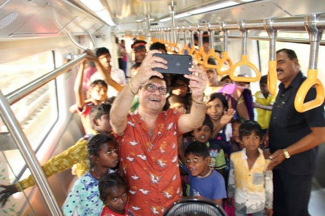 Actors Swapnil Joshi, Pranali Ghoghre and Sachin Pilgaonkar take a selfie with underprivileged children in the Nagpur Metro (Maha Metro/Facebook)