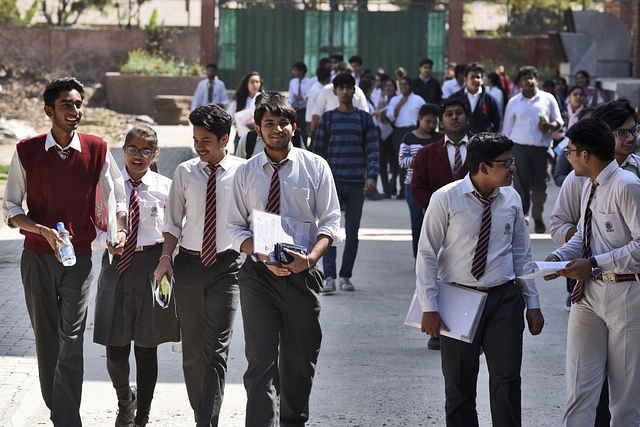 Students coming out after appearing for exams. (Burhaan Kinu/Hindustan Times via Getty Images)