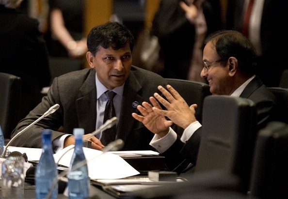 Former RBI governor Raghuram Rajan with P Chidambaram. (Jason Reed/Pool via Getty Images)