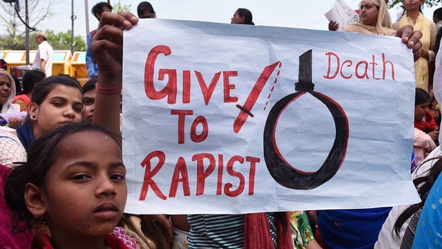 Supporters hold placards during a demonstration in New Delhi (Mohd Zakir/Hindustan Times via Getty Images)