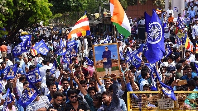 Dalits staging a protest during the Bharat <i>bandh</i> called by several Dalit organisations to protest against a Supreme Court order which allegedly dilutes a law protecting their rights. (Subhankar Chakraborty/Hindustan Times via Getty Images)