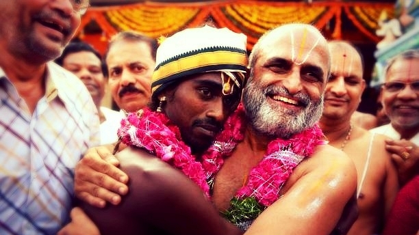 Chilkur Balaji Temple archaka C S Rangarajan, right, and Aditya Parasri, a person belonging to the Scheduled Caste. (Kiran Kumar S/Twitter)