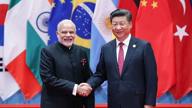 Chinese President Xi Jinping with Prime Minister Narendra Modi. (Lintao Zhang via Getty Images)