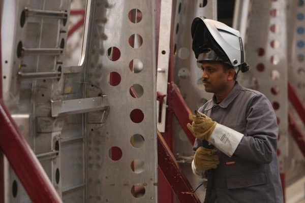 A worker  welds the fuselage of a subway car destined for New Delhi (Sean Gallup/Getty Images)