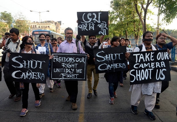 Media personnel take part in a silent rally to protest against recent incident of attack on media person. (Saikat Paul/Pacific Press/LightRocket via Getty Images)