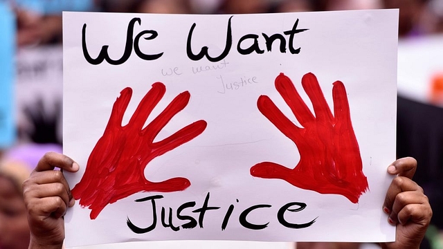 A placard during a demonstration in Delhi (Mohd Zakir/Hindustan Times via Getty Images)