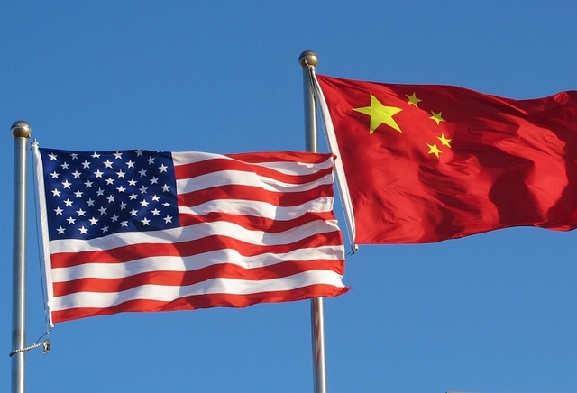 American and Chinese flags.&nbsp;