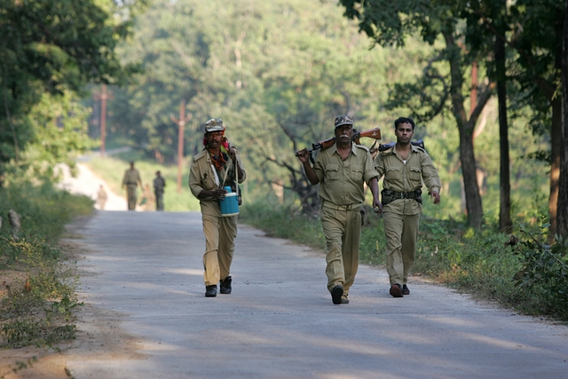 Police officers patrolling the naxal infested forests at Bijapur near Dantewada. (Sattish Bate/Hindustan Times via Getty Images)