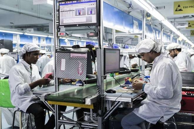 Technicians assemble smartphones on the production line in Noida. (Udit Kulshrestha/Bloomberg via GettyImages)