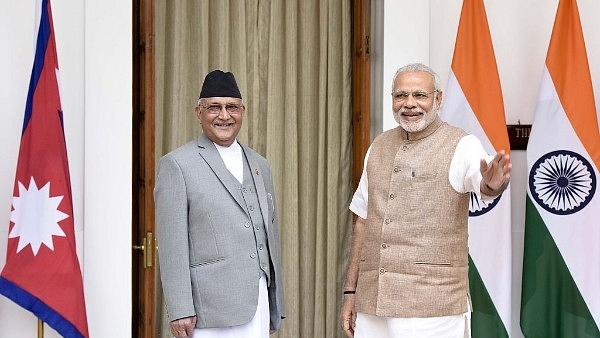 Prime Minister Narendra Modi (R) with Nepal Prime Minister Khadga Prasad Sharma Oli  in New Delhi in 2016. (Sonu Mehta/Hindustan Times via Getty Images)