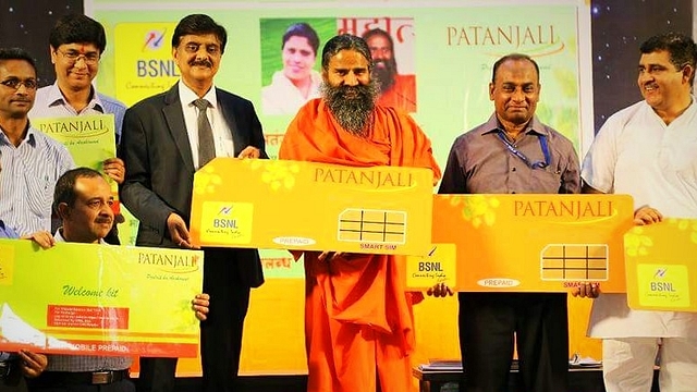 Baba Ramdev launches the Patanjali SIM. (pic via Twitter)