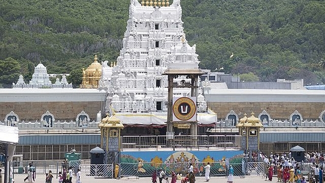 Facade of Tirumala Venkateshwar <i>garbhagriha</i> in the background. (Nikhil B/Wikimedia Commons)