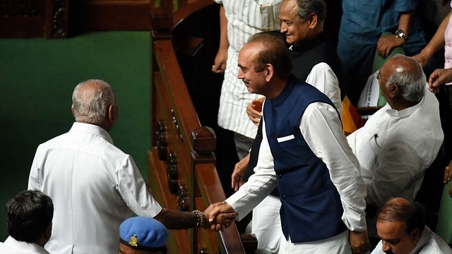  Leader of the Opposition Rajya Sabha Ghulam Nabi Azad shakes hand with BS Yeddyurappa after he resigned as the 23rd Chief Minister of Karnataka (Arijit Sen/Hindustan Times via Getty Images)