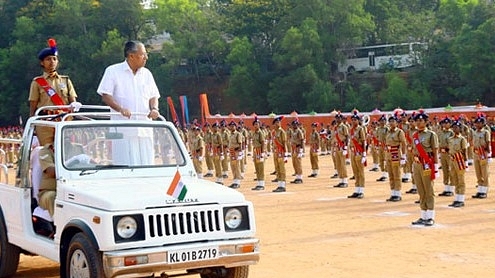 Kerala Chief Minister Pinarayi Vijayan observes a police ceremony. (pic via Kerala Police site)