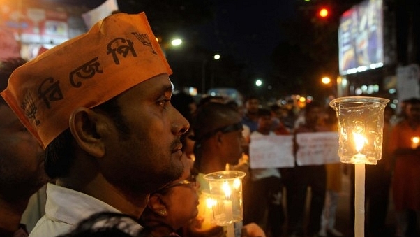 State BJP Yuva Morcha organised a candle march to protest against violence and death of 20 people of different political parties in West Bengal panchayat polls 2018. (Samir Jana/Hindustan Times via Getty Images)