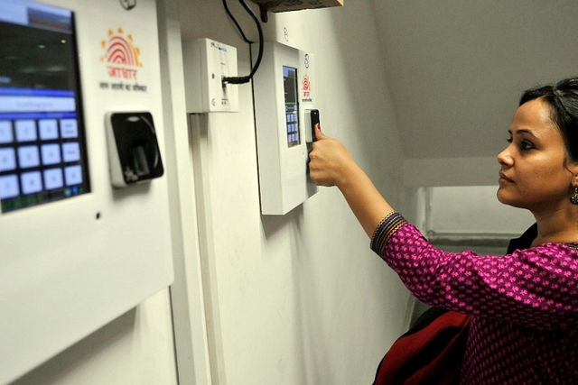 An employee marks her attendance through Aadhaar based System in the Planning Commission  in New Delhi. (Vipin Kumar/Hindustan Times via GettyImages)