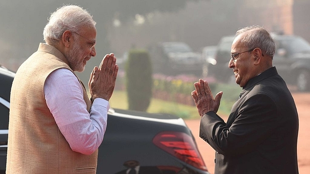 Pranab Mukherjee (R) with PM Narendra Modi. (Virendra Singh Gosain/Hindustan Times via Getty Images)