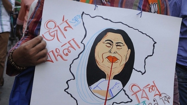 A protest rally against TMC violence. (Samir Jana/Hindustan Times via Getty Images)