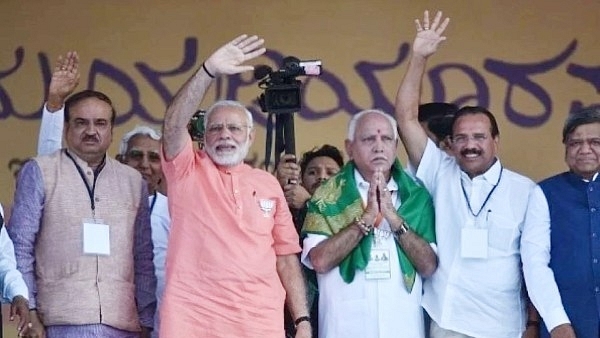 Prime Minister Narendra Modi with BJP’s chief ministerial candidate for upcoming Karnataka Assembly election, B S Yeddyurappa, at a rally. (Arijit Sen/Hindustan Times via GettyImages)