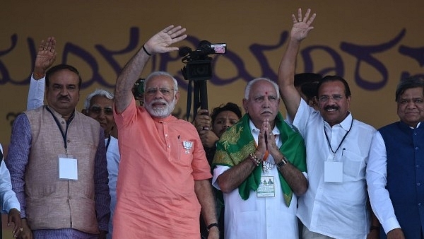  Prime Minister Narendra Modi with Karnataka state BJP president and chief ministerial candidate for upcoming state assembly election, B S Yeddyurappa, Union minister Ananth Kumar, and Sadanand Gowda in Davangere. (Arijit Sen/Hindustan Times via Getty Images)