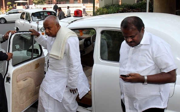 Former prime minister H D Deve Gowda and his son H D Kumaraswamy at Parliament House in New Delhi.&nbsp; (Mohd Zakir/Hindustan Times via Getty Images)&nbsp;