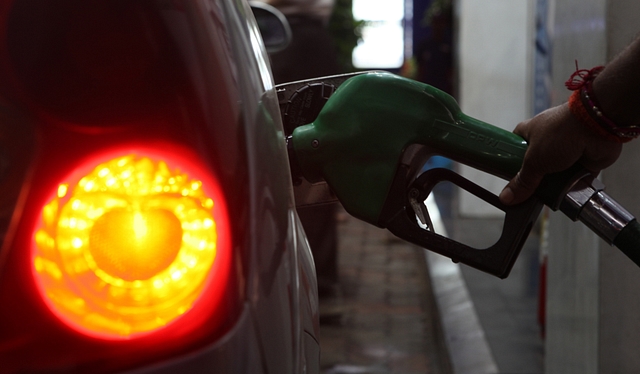 A car owner gets his fuel tank filled at a petrol-pump at Prabhadevi. (Anshuman Poyrekar./Hindustan Times via GettyImages)