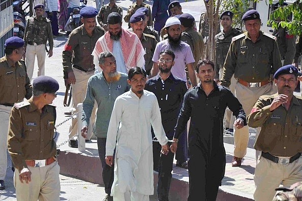 The SIMI men in police custody before they escaped. (Praveen Bajpai/Hindustan Times via Getty Images)