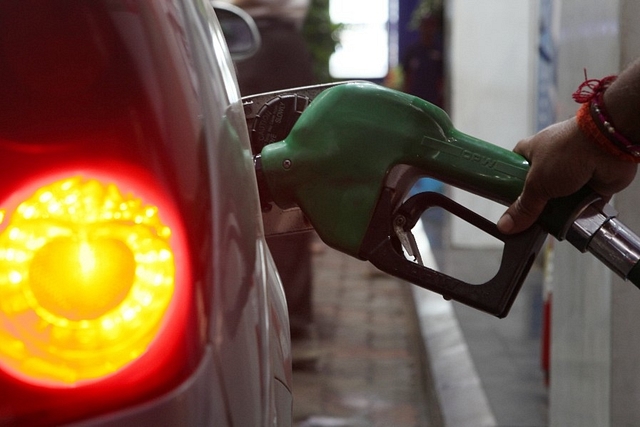 A car owner gets his fuel tank filled at a petrol-pump at Prabhadevi. (Anshuman Poyrekar/Hindustan Times via GettyImages)