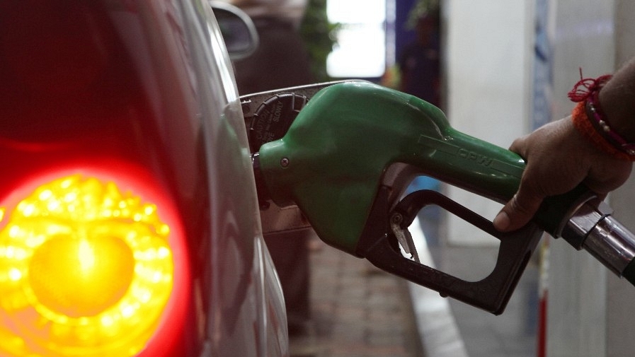 A car owner gets his fuel tank filled at a petrol-pump at Prabhadevi. (Anshuman Poyrekar./Hindustan Times via GettyImages)