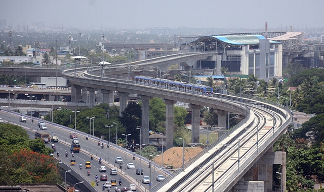 A Chennai Metro train leaves the Alandur station near the Kathipara cloverleaf interchange (Jaison G/India Today Group/Getty Images)