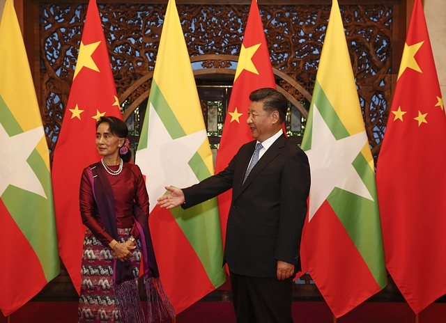 Myanmar State Counsellor Aung San Suu Kyi and Chinese President Xi Jinping. (ROLEX DELA PENA/AFP/Getty Images)