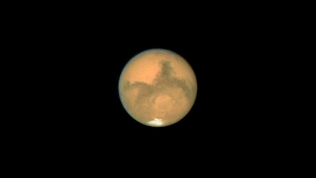 A picture of the Red Planet released by NASA. The southern polar ice cap is visible in the picture. (NASA/Getty Images)