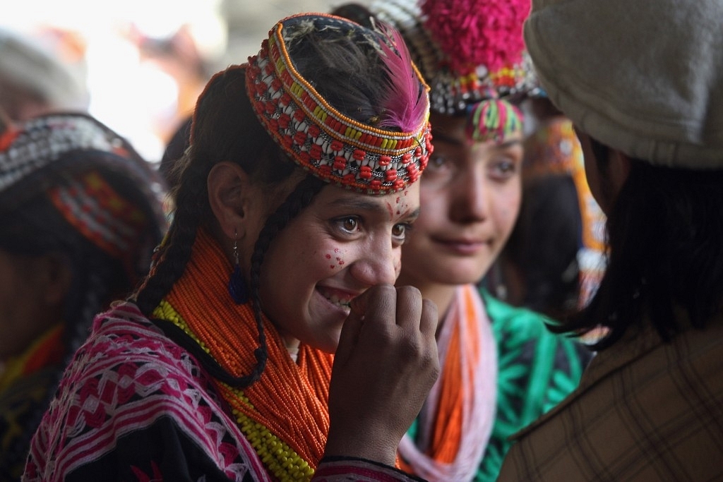 Girls and boys from the Kalash tribe during the Joshi spring festival on 15 May 2008 in the remote Chitral village of Rumbur in northwestern Pakistan. (John Moore/GettyImages)