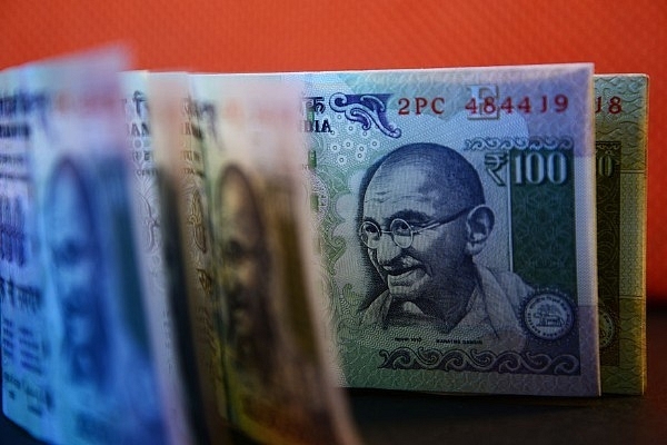 A bundle of Rs 100 currency notes. (Ramesh Pathania/Mint via Getty Images)