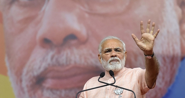 Prime Minister of India Narendra Modi during BJP rally ahead of Karnataka state Assembly election at National College Ground on 8 May 2018 in Bengaluru, India. (Arijit Sen/Hindustan Times via Getty Images)