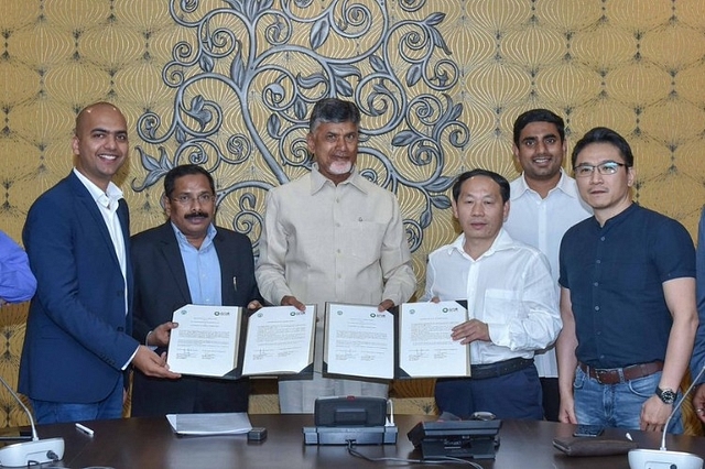 Xiaomi India Chief Manu Jain with AP CM Chandrababu Naidu and Holitech officials. (pic via Twitter)