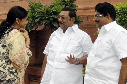 Muthuvel Karunanidhi Azhagiri talking with sister Kanimozhi Karunanidhi ((Photo By Sonu Mehta/Hindustan Times via Getty Images)