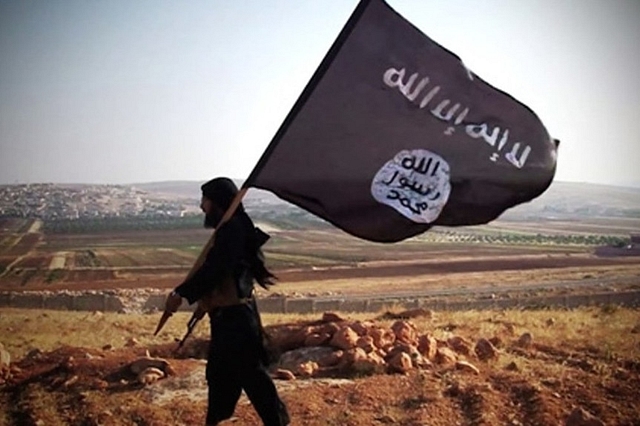 ISIS fighter with a flag. 