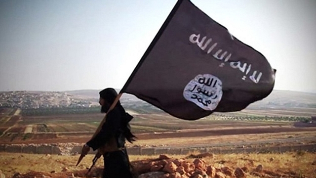 ISIS fighter with a flag. 