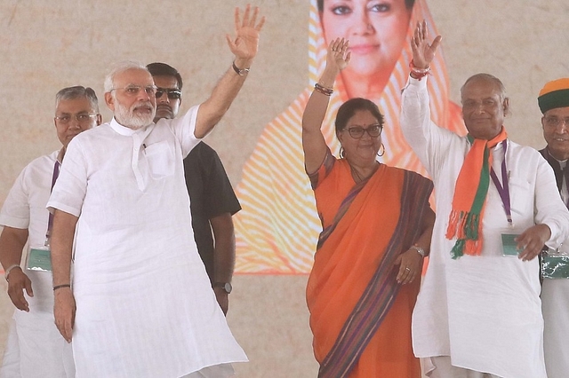 Narendra Modi with Vasundhara Raje and state BJP President Madanlal Saini, at a meeting in Amrudon Ka Bagh,  in Jaipur. (Himanshu Vyas/Hindustan Times via GettyImages)&nbsp;