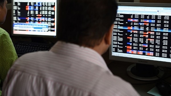 Indian stock traders watch share prices on their terminals. (INDRANIL MUKHERJEE/AFP/Getty Images)