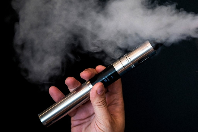 Vape Lab employee Leonardo Verzaro uses an E-Cigarette. (Dan Kitwood/Getty Images)&nbsp;