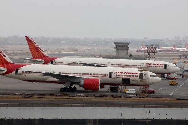 Air India aircraft are seen parked on the tarmac of the international airport in Mumbai. (Sattish Bate/Hindustan Times via Getty Images)