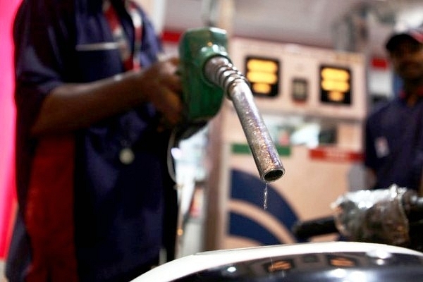 A car owner gets his fuel tank filled with petrol from a petrol pump at Prabhadevi. (Sattish Bate/Hindustan Times via Getty Images)