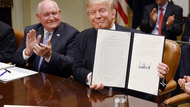 US President Donald Trump with  Agriculture Secretary Sonny Perdue. (Olivier Douliery-Pool/Getty Images)