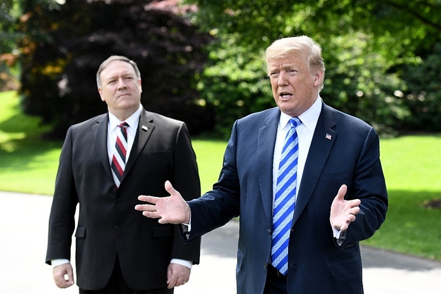 US Secretary of State Mike Pompeo listens and US President Donald Trump (Olivier Douliery-Pool/GettyImages)