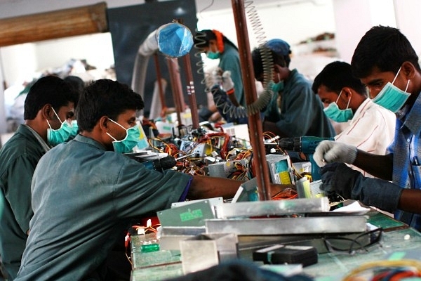 Factory workers in India (Uriel Sinai/Getty Images)