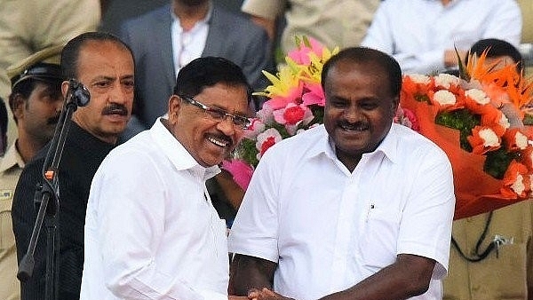 H D Kumaraswamy and former Deputy Chief Minister G Parameshwara (L). (Arijit Sen/Hindustan Times via Getty Images)