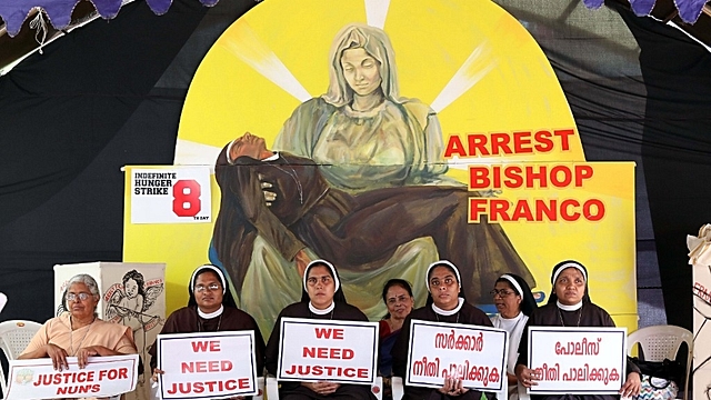 Nuns hold placards during a protest demanding justice after an alleged sexual assault of a nun by a bishop. (Vivek Nair/Hindustan Times via Getty Images)