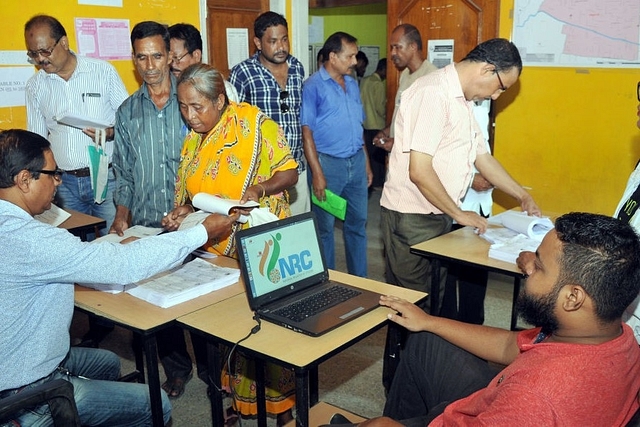 People check their name on the final draft list of Assam’s NRC list at NRC Seva Kendra at Hatigaon in Guwahati. (Rajib Jyoti Sarma/Hindustan Times via GettyImages)